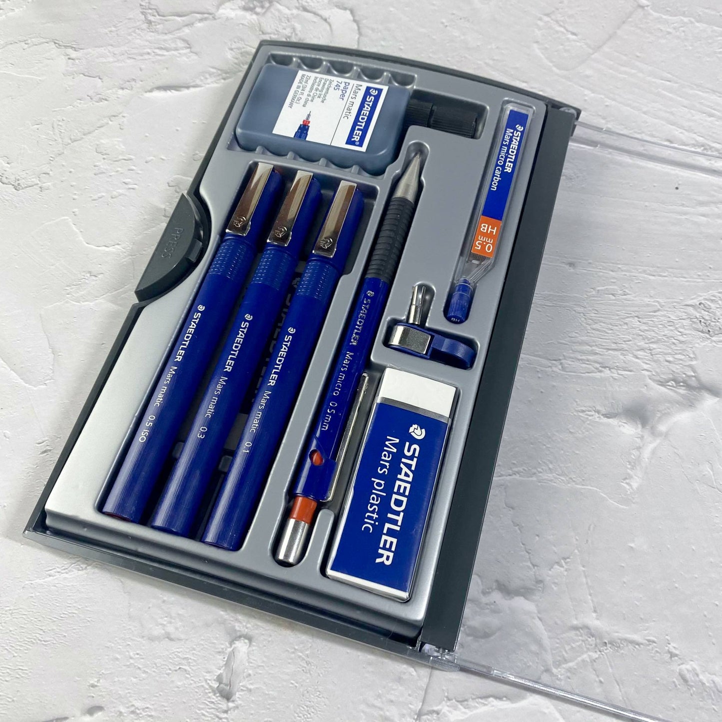 Technical ink pens remain the go-to for precision line work in architectural drawing, though their use in modern day courses is limited. This comprehensive set of writing tools is an essential for architecture students.